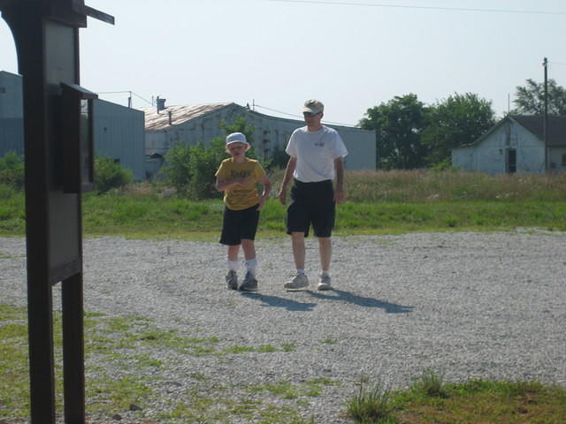 Dan and Samuel "hiking" in the parking area.