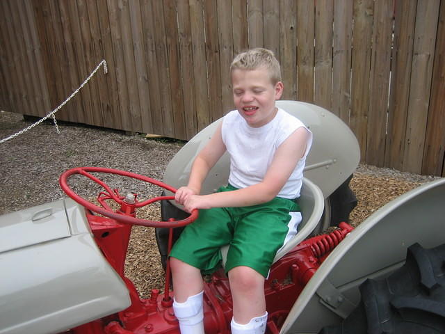 He loved sitting on the tractor!