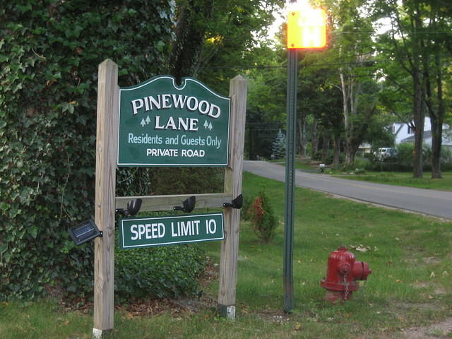 The entrance to the street the house is on.