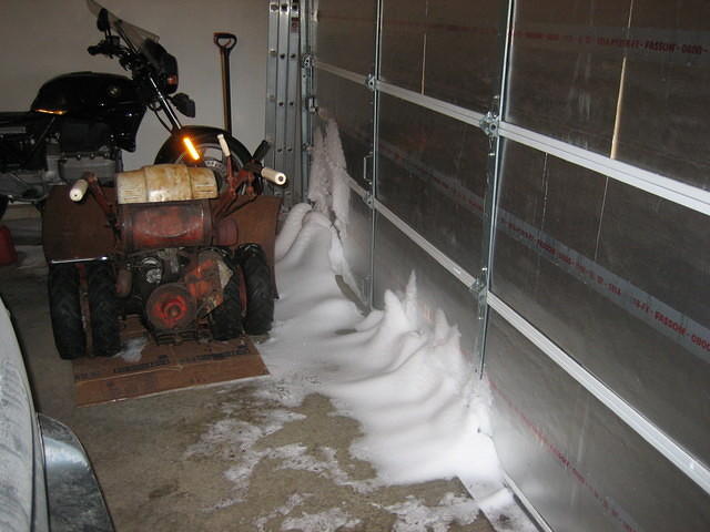 Snow blowing into the garage.