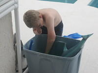 Samuel choosing his toys for the pool.