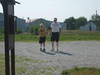 Dan and Samuel "hiking" in the parking area.