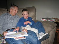 But the cat keeps trying to get his attention!