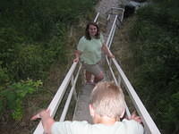 Samuel descending the stairs to the beach.