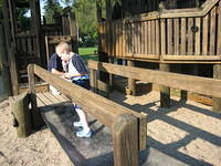 Samuel on the bridge at the Kids Corner playground.