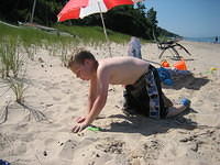 Samuel loved playing the sand. Mostly he threw it.