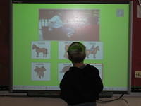 Samuel at the SmartBoard in his class.